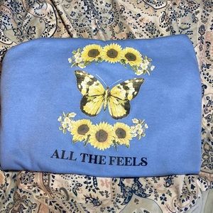 A solid blue colored oversized sweatshirt shirt and hoodless